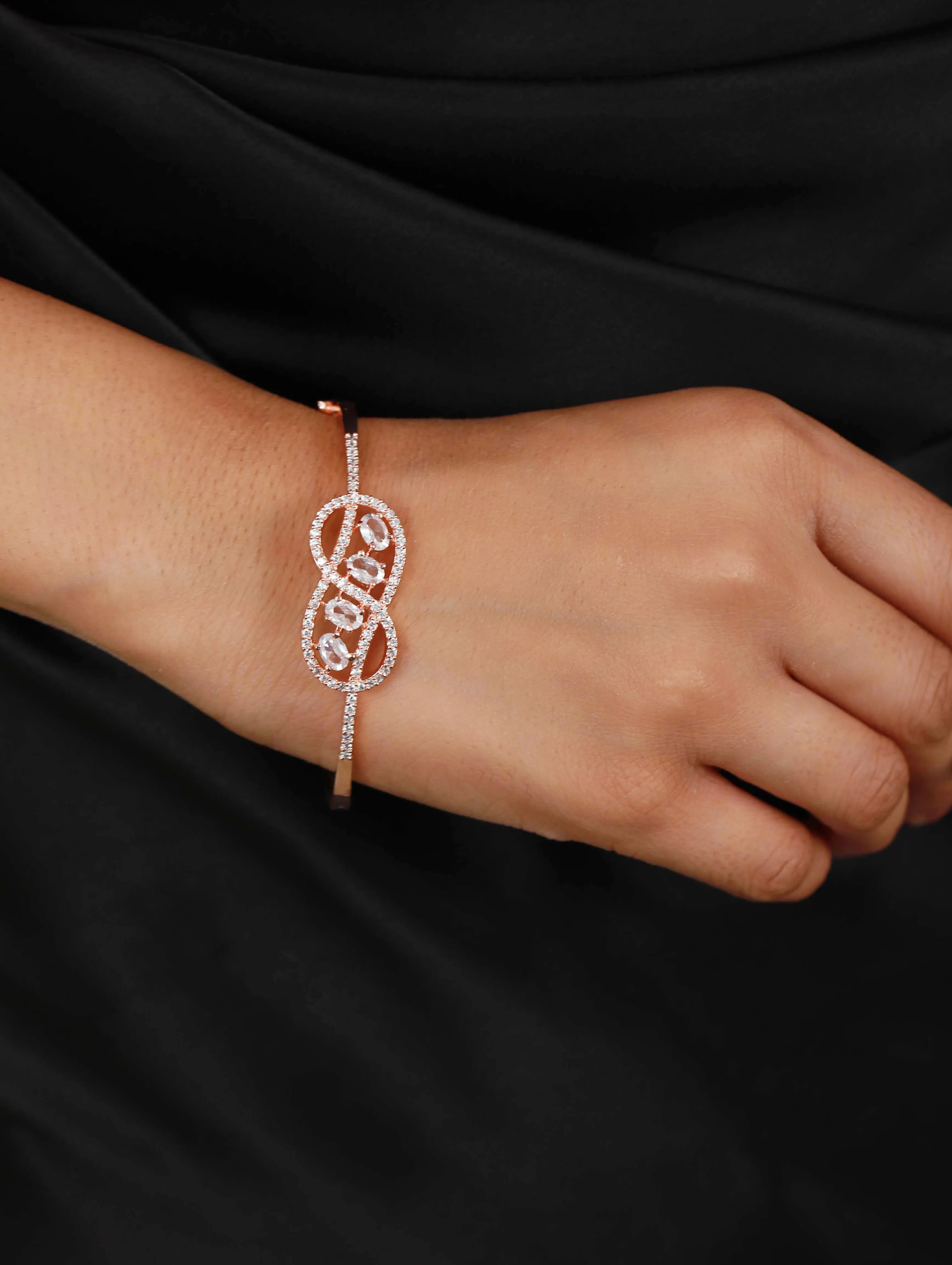 Rose Gold Plated White American Diamond Studded Handcrafted Infinity Shaped Bangle-Style Bracelet