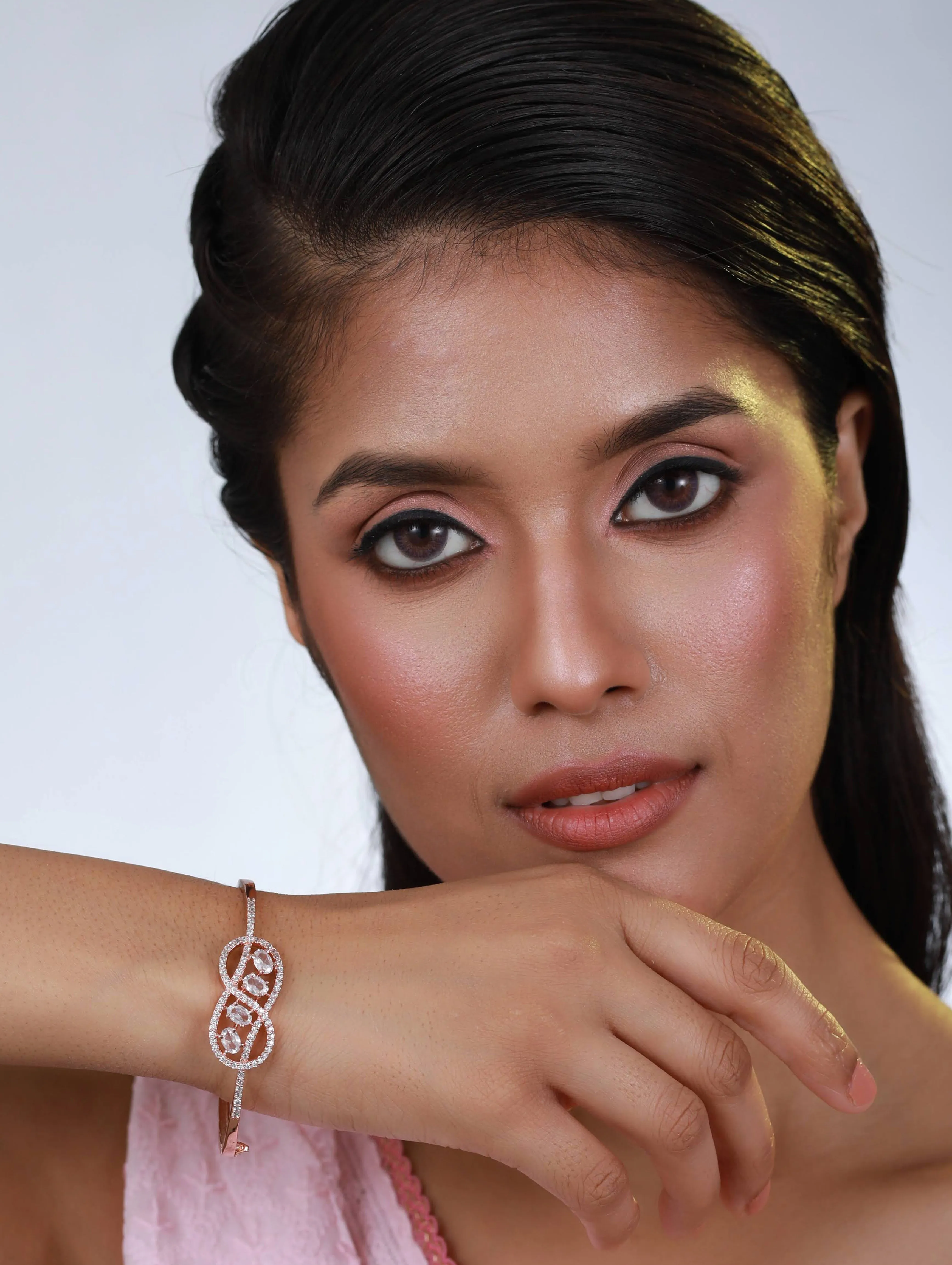 Rose Gold Plated White American Diamond Studded Handcrafted Infinity Shaped Bangle-Style Bracelet